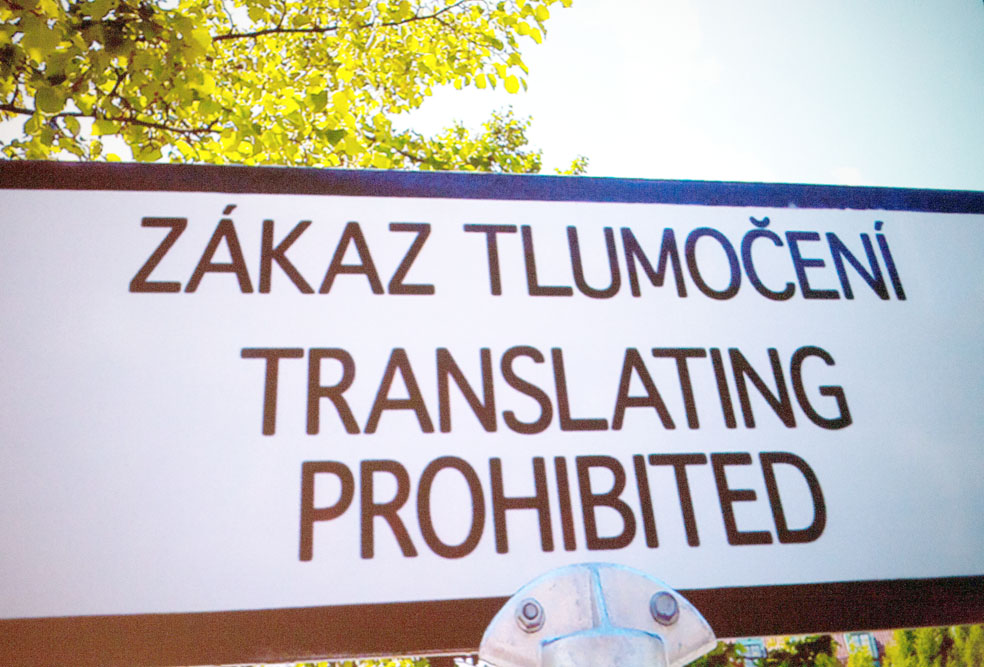 Sign saying "Translating prohibited" in Polish, with a translation into English directly beneath