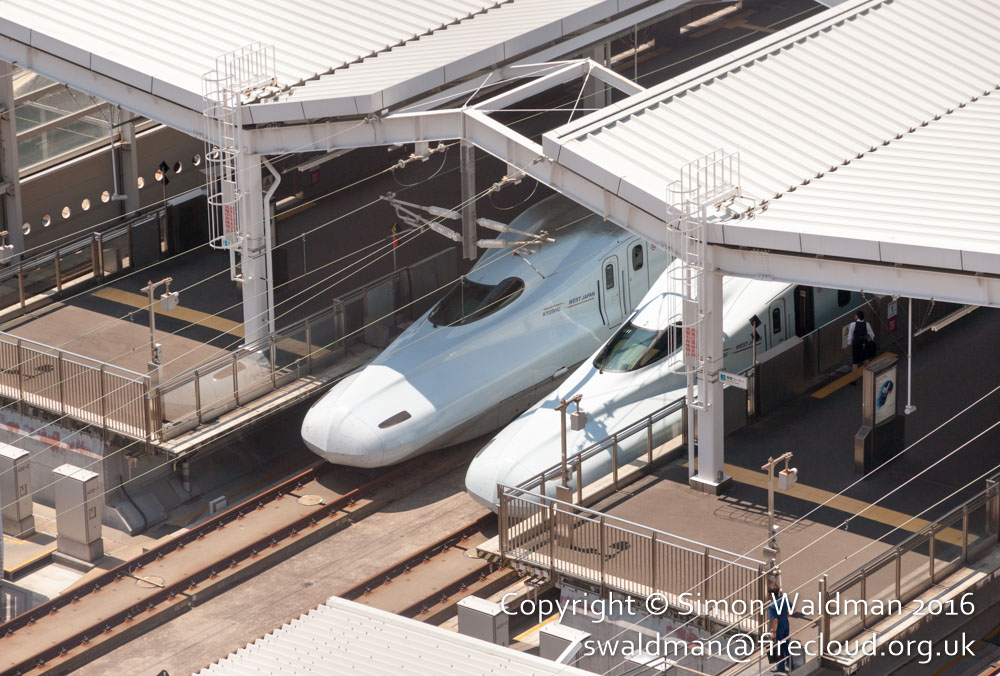 Noses of two N700-series Shinkansen trains (bullet trains) in a station