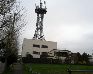 Communications tower rising from a municipal telecoms building in Japan