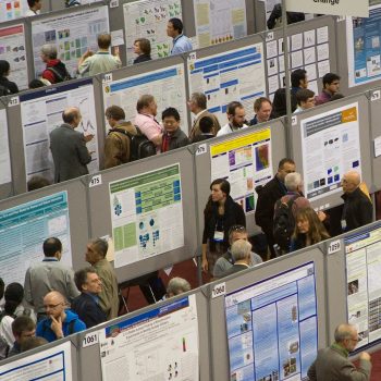 View of rows of academic posters at a poster session.
