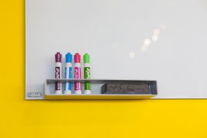 Whiteboard markers and a whiteboard.