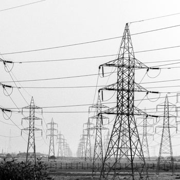 Black and white picture of lots of transmission towers